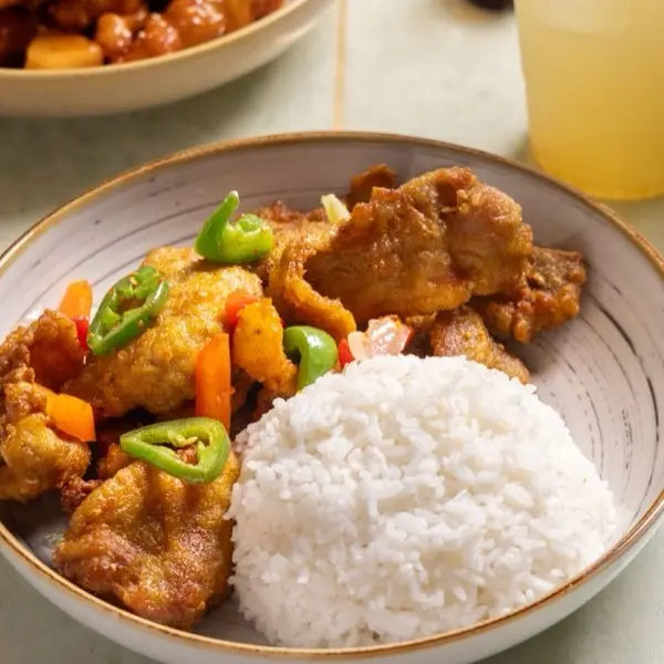 Salt and pepper fried pork with green and red pepper, served with steamed rice