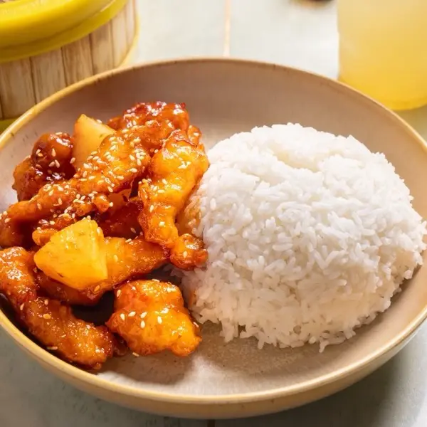 Sweet and sour chicken with pineapple, served with steamed rice