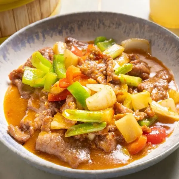 Braised beef with potato, celery and sweet pepper in a rich sauce