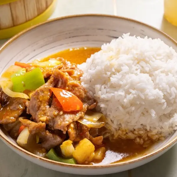 Curry beef with potato, carrot and celery, served with steamed rice