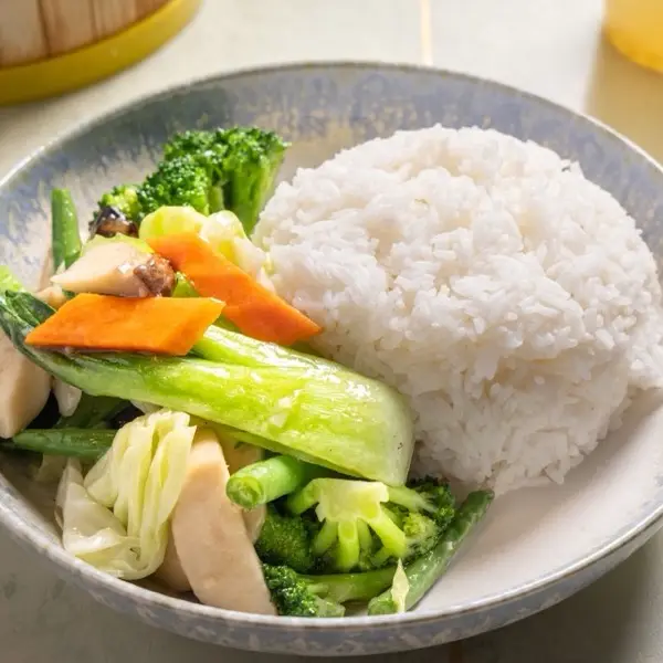 Stir-fried mixed vegetables with bok choy, broccoli and mushroom, served with steamed rice