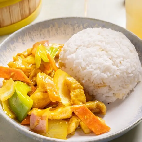 Curry chicken with carrot and celery, served with steamed rice