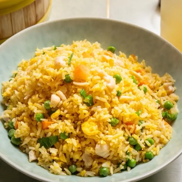 Egg fried rice with peas, carrot and onion